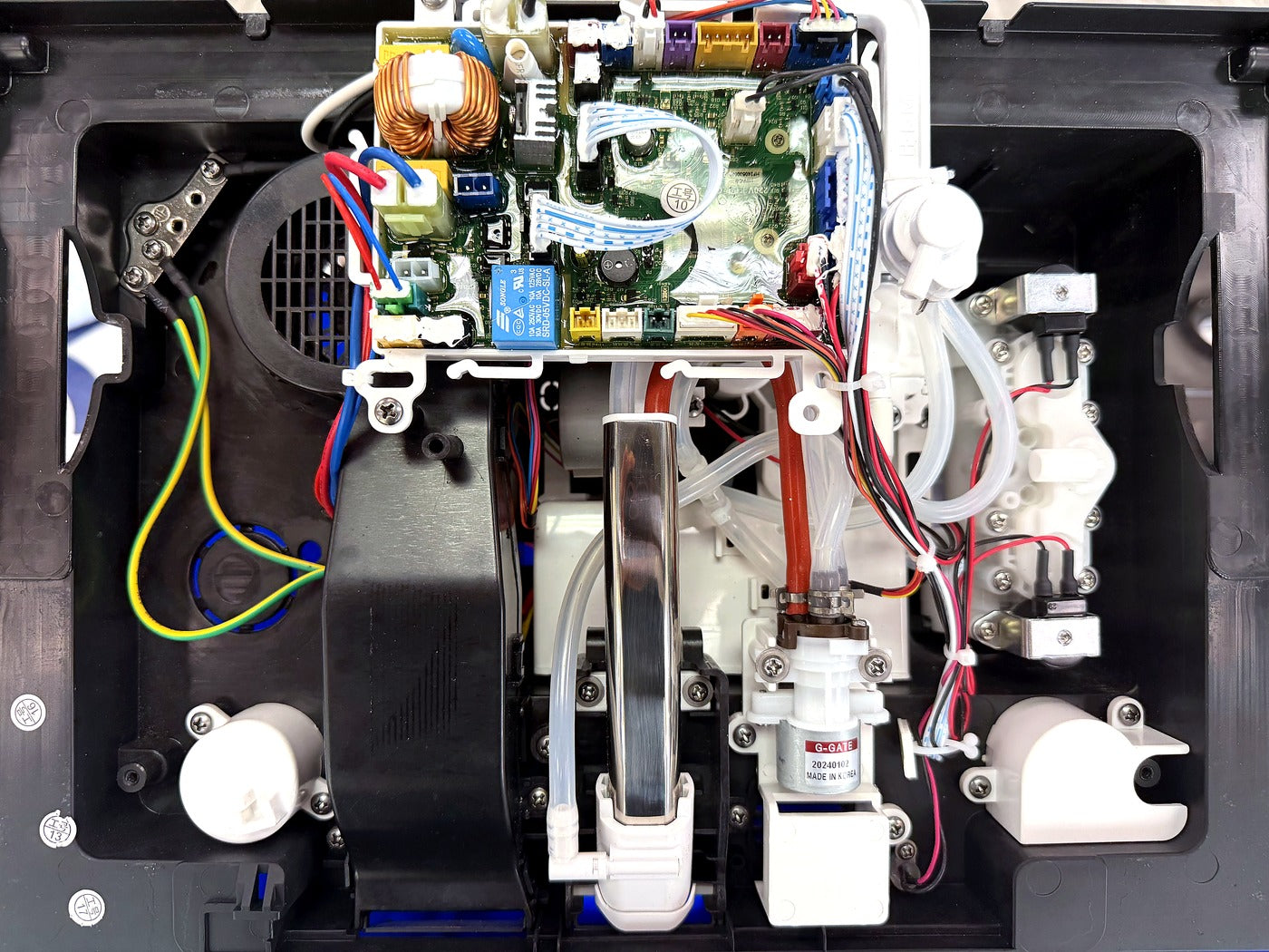 Open SEEWIN smart toilet mechanism showing its control board, dryer, water channels, tubing, motors and valves